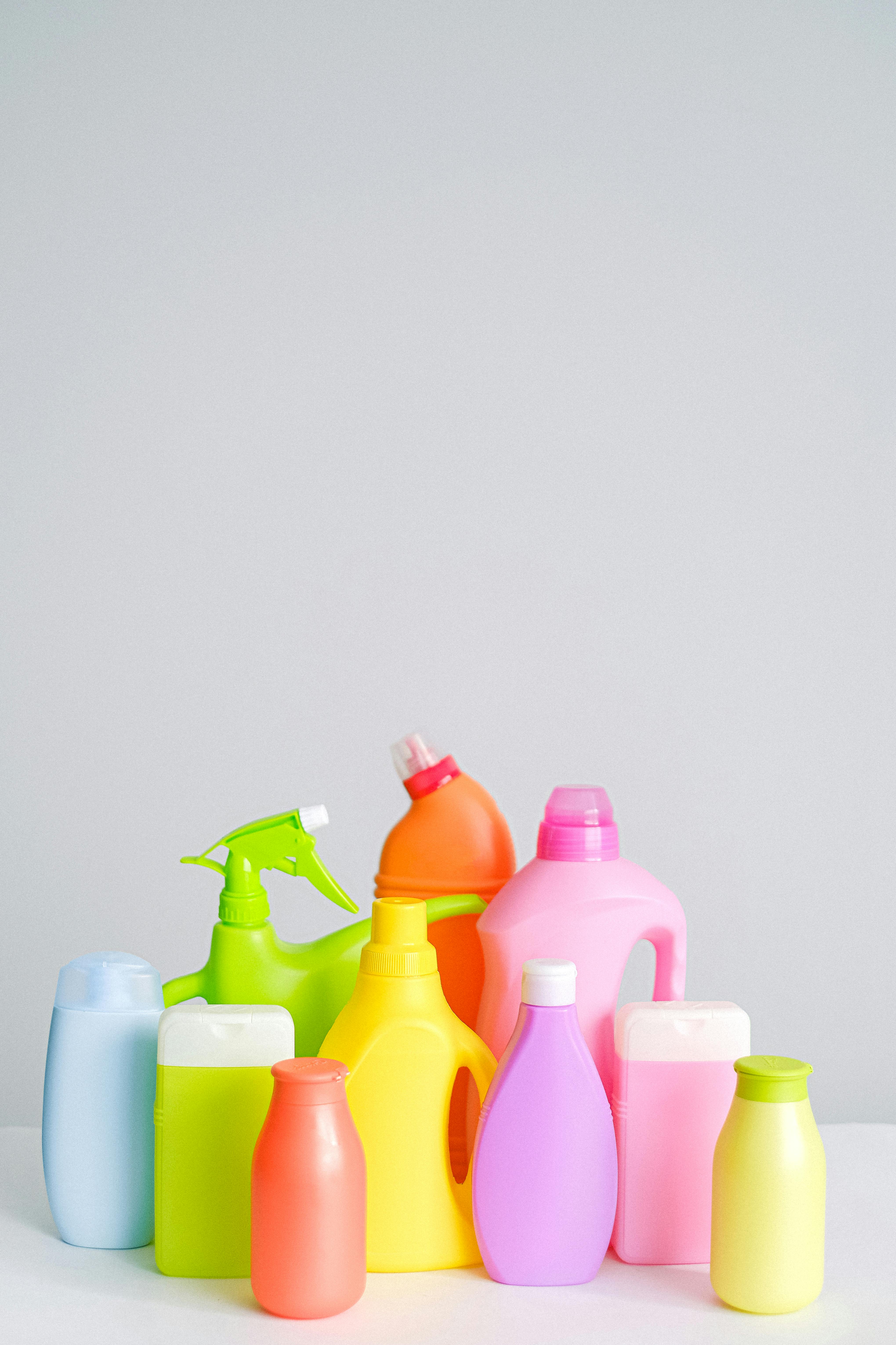 Collections of bottles of household detergents and cleaners
